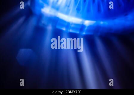 Photo of Rays Emitting Blue Structure Background in Darkness Stock Photo