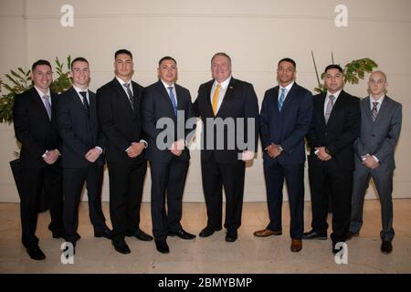 Secretary Pompeo Meets With U.S. Embassy Asunción Staff and Families U.S. Secretary of State Michael R. Pompeo poses for a photograph with Marine Security Guards at U.S. Embassy Asunción, in Asunción, Paraguay, April 13, 2019. Stock Photo