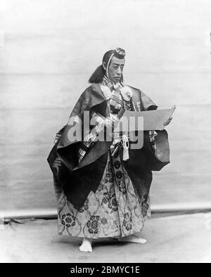 [ 1890s Japan - Kabuki Actor Ichikawa Danjuro IX ] —   Japanese kabuki actor Ichikawa Danjuro IX (九代目 市川 團十郎, 1838-1903). Danjuro was one of the most successful and famous Kabuki actors of the Meiji period (1868–1912).  From a series of glass slides published (but not photographed) by Scottish photographer George Washington Wilson (1823–1893). Wilson’s firm was one of the largest publishers of photographic prints in the world.  19th century vintage glass slide. Stock Photo