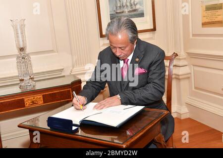 Malaysian Foreign Minister Aman Signs the Department of State Guest Book Malaysian Foreign Minister Anifah Aman signs the guest book at the U.S. Department of State in Washington, D.C. on March 26, 2018. Stock Photo