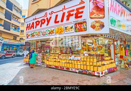 DUBAI, UAE - MARCH 2, 2020: The large spice store of Deira Grand Souq (market) with large amount of boxes with spices, flower petals, herbs, dried fru Stock Photo