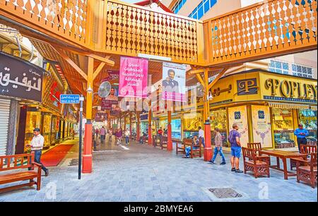 DUBAI, UAE - MARCH 2, 2020: The open air junction in the Gold Souq, decorated with carved wooden panels and pillar; lined with jewelry stores and souv Stock Photo