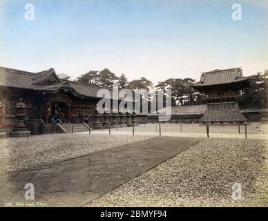 [ 1890s Japan - Zojoji Temple, Tokyo ] —   Gate and stone lanterns at Zojoji Temple in Shiba, Tokyo.   Six Tokugawa Shoguns and wives and children of shoguns were entombed at the Tokugawa mausoleum at Zojoji.  Much of the mausoleum was destroyed during the Great Kanto Earthquake of 1923 (Taisho 12) and what survived, was burnt down during the US fire bombings of Tokyo in 1945 (Showa 20).  19th century vintage albumen photograph. Stock Photo