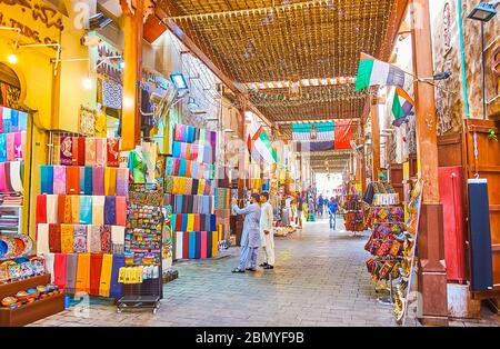 DUBAI, UAE - MARCH 2, 2020: Walk the old alleyway of Bur Dubai Grand Souq, choose the souvenirs, magnets, cashmere scarves, pottery and accessories, o Stock Photo