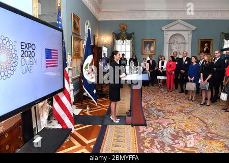 Secretary Pompeo Listens as Assistant Secretary Giuda Delivers Closing Remarks Assistant Secretary for Public Affairs Michelle Giuda delivers opening remarks and introduces Secretary of State Michael R. Pompeo at a reception supporting the U.S. Pavilion at Expo 2020, at the U.S. Department of State in Washington D.C. on July 29, 2019. Stock Photo