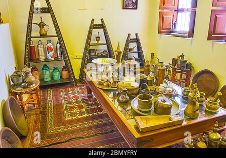 DUBAI, UAE - MARCH 2, 2020: Interior of Coffee Museum with examplex of vintage cookware for coffee making - dallah coffee pots, copper boiling pots, k Stock Photo