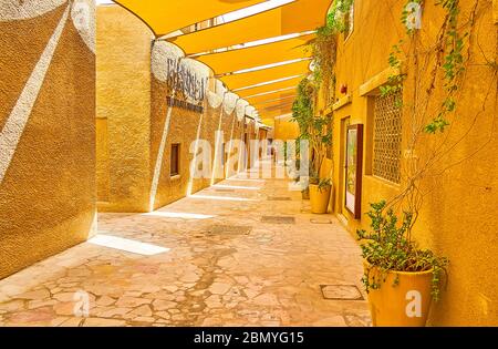 DUBAI, UAE - MARCH 2, 2020: It's easy to get lost, walking the narrow curved and chaotic streets of Al Bastakiya (Al Fahidi) historical district of ol Stock Photo