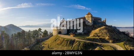 Aerial drone panoramic view of Historical fortress in Risnov or Rasnov. Romania Stock Photo