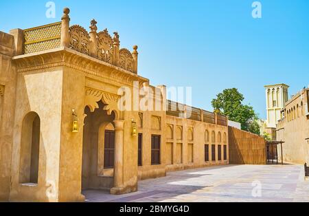 The scenic mansion with carved details and shady porch, located in historical Al Bastakiya (Al Fahidi) neighborhood of Dubai, UAE Stock Photo