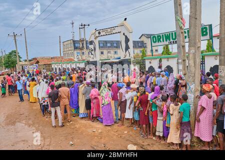 People queue up for relief packages during the Covid-19 coronavirus pandemic lockdown at Oriwu Club in Ikorodu, Lagos - Nigeria. Stock Photo