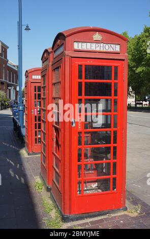 Row of old red telephone boxes Stock Photo