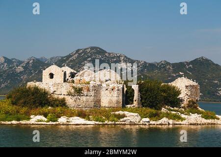 A close up view at Grmozur Fortress ruin, former prison at the island Grmozur in Lake Skadar National Park in Montenegro, famous tourist attraction. Stock Photo