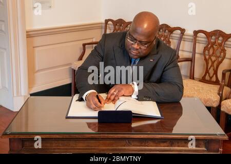 Democratic Republic of the Congo President Tshisekedi Signs the Guest Book Democratic Republic of the Congo President Felix Tshisekedi signs the guest book, at the Department of State, on March 3, 2020. Stock Photo