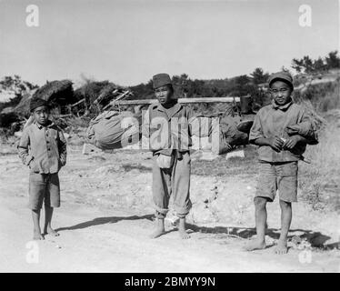 [ 1946 Japan - Okinawan Boys in Military Clothing ] —   Three boys in military clothing in Okinawa, 1946 (Showa 21).  20th century gelatin silver print. Stock Photo