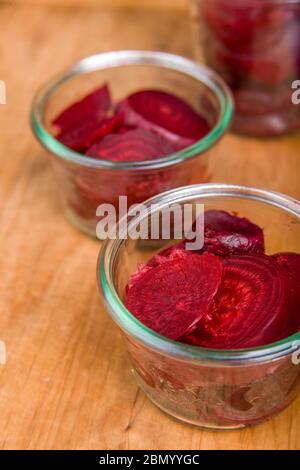 Pack the sliced beets into the canning jars.  This is called 'hot packing'!  Pack the jars fairly tightly, but be sure to leave ½-inch of space at the Stock Photo