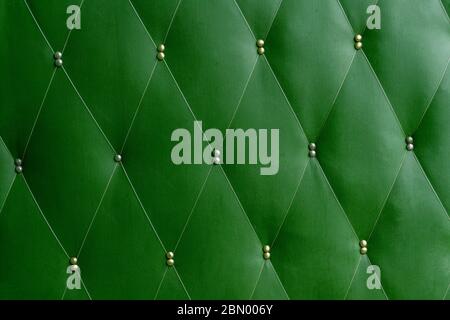 Soviet soft green dermantine front door with a banner of fishing line and nails - full frame background and texture Stock Photo