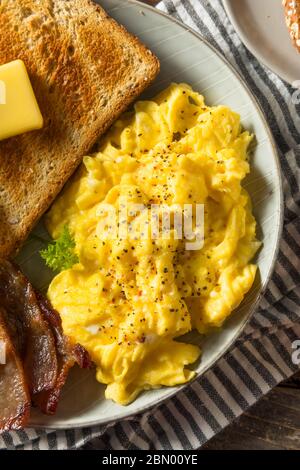 Homemade American Scrambled Egg Breakfast with Bacon and Toast Stock Photo
