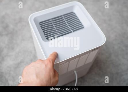 Air purifier in the room. Air washing system. Stock Photo