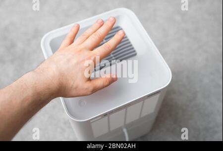 Air purifier in the room. Air washing system. Stock Photo