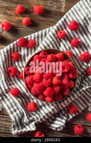 Raw Organic Red Raspberries in a Bowl Stock Photo