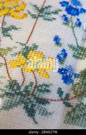 Counted cross stitched flower motif detail, 1980s Stock Photo
