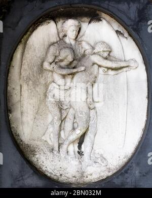 Bas-relief of two figures incised on a tomb in Brompton Cemetery, Kensington, London; one of the 'Magnificent Seven' London cemeteries, built in 1840 Stock Photo