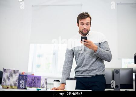 A portrait of a young architect talking to someone over the phon Stock Photo