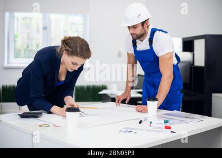Two architects working on a project in the office Stock Photo