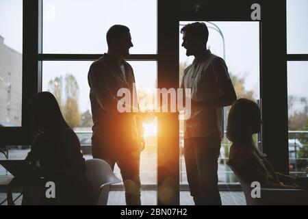 Handshaking business person in office. concept of teamwork and partnership. Stock Photo