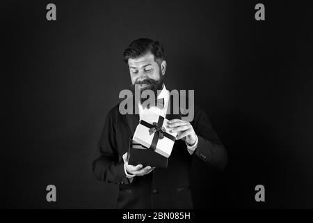 Not for sale. Happy boss hold present box dark background. Happy man getting gift. Happy holidays. Happy birthday. Holiday celebration. Boxing day. Stock Photo