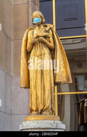 Trocadero statue with a facial mask during Covid-19 Lockdown - Paris Stock Photo