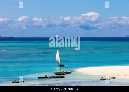 Fishing boats in turquoise green water on the beach of Kendwa, Zanzibar, Tanzania Stock Photo