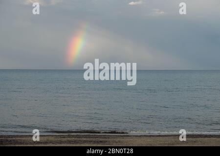 A rainbow over the North Sea near Hemsby  Norfolk England UK Stock Photo