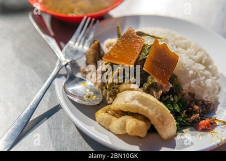 Local Pork and Rice Dish from Bali, Indonesia at market Stock Photo