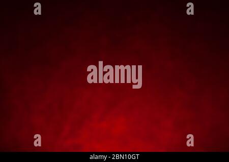 Black and red textural background in defocus. Stock Photo