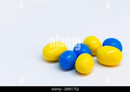 blue and yellow candy eggs for Easter Stock Photo