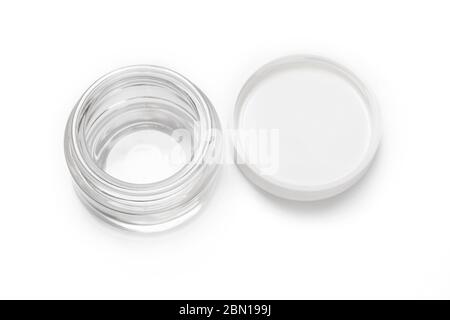 Open empty transparent glass container jar for cosmetic cream with white cover isolated on white background, blank, mockup. Stock Photo