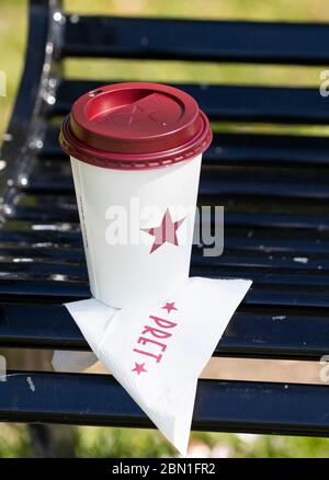 Pret A Manger takeaway coffee cup on a park bench in Edinburgh as the UK continues in lockdown to help curb the spread of the coronavirus. Stock Photo