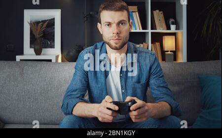 Man playing video games Stock Photo
