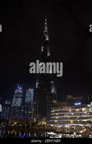 DUBAI, UNITED ARAB EMIRATES - NOVEMBER 19, 2019: Burj Khalifa skyscraper and Dubai Mall illuminated at night Stock Photo