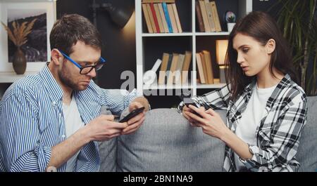 Couple using their cellphones Stock Photo