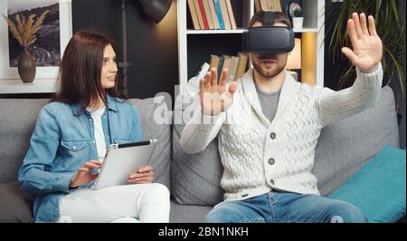 Couple having fun with VR-headset Stock Photo