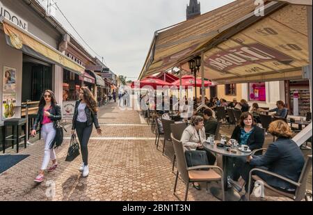 Sidewalk cafes at ulica Ivana Pavla II (John Paul the 2nd Street), pedestrian area in Dakovo, Slavonia, Croatia Stock Photo