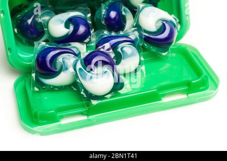 Washing machine detergent pods in a plastic box on a white background Stock Photo