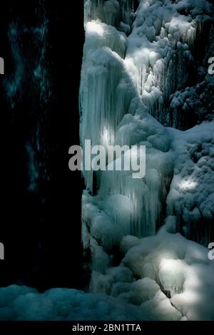 Vertical shot of Ice waterfall in Auvergne-Rhone-Alpes, France Stock Photo