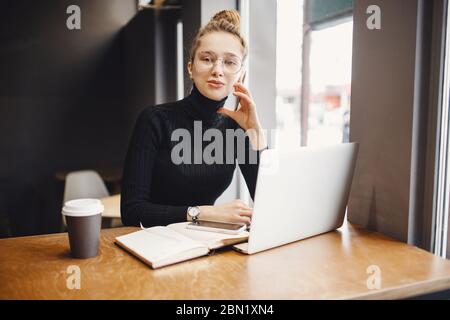 Woman works remotely online from home while quarantine coronavirus is in effect. Concept of checking mail, blogger Stock Photo