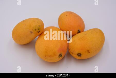 fresh mangoes on a white background Stock Photo