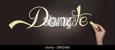Hand writing the word Donate with chalk on blackboard. Donation help volunteers support concept Stock Photo