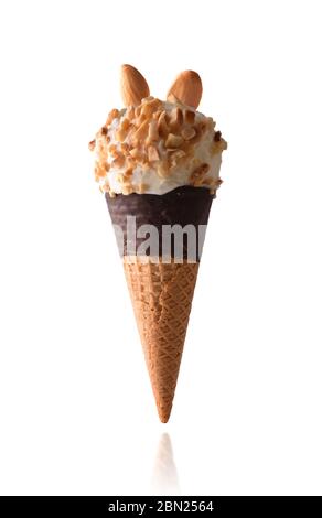 Almond flavored cream ice cream with Pieces of fruit isolated with white background on semi-dipped chocolate cone Stock Photo