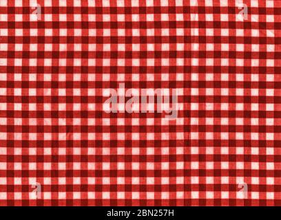 The texture of the bright red of binding gingham fabric. Red textile background. Fabric plaid. Close-up Stock Photo
